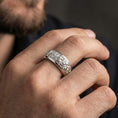 Load image into Gallery viewer, Polished silver rose engraved spinner band worn on hand emphasizing smooth comfort fit, rotating motion, and modern floral minimal styling
