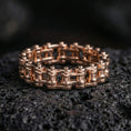 Load image into Gallery viewer, Rose gold plated steampunk chain wheel ring presented on volcanic rock surface with premium workshop aesthetic and refined industrial finish
