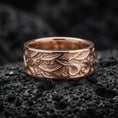 Load image into Gallery viewer, Rose gold plated vintage wave pattern band ring presented on volcanic rock, emphasizing sculpted flowing curves and modern-unisex style appeal
