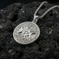 Load image into Gallery viewer, Polished silver triple moon pentagram necklace on porous volcanic stone, detailed Celtic knotwork medallion with bail
