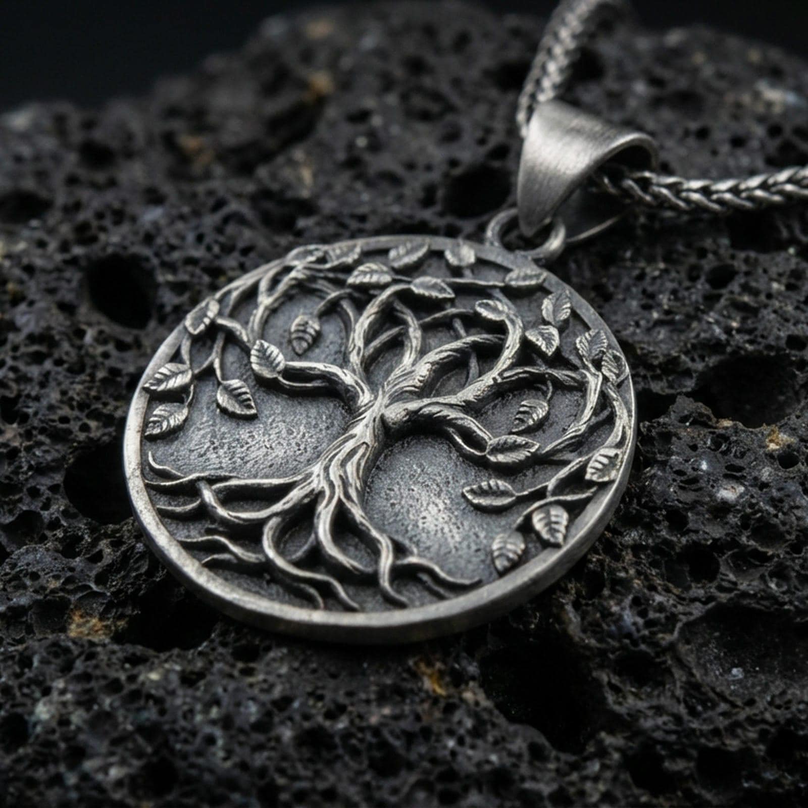 Oxidized 925 sterling silver Tree of Life pendant on volcanic rock, raised Yggdrasil branches and roots with braided chain