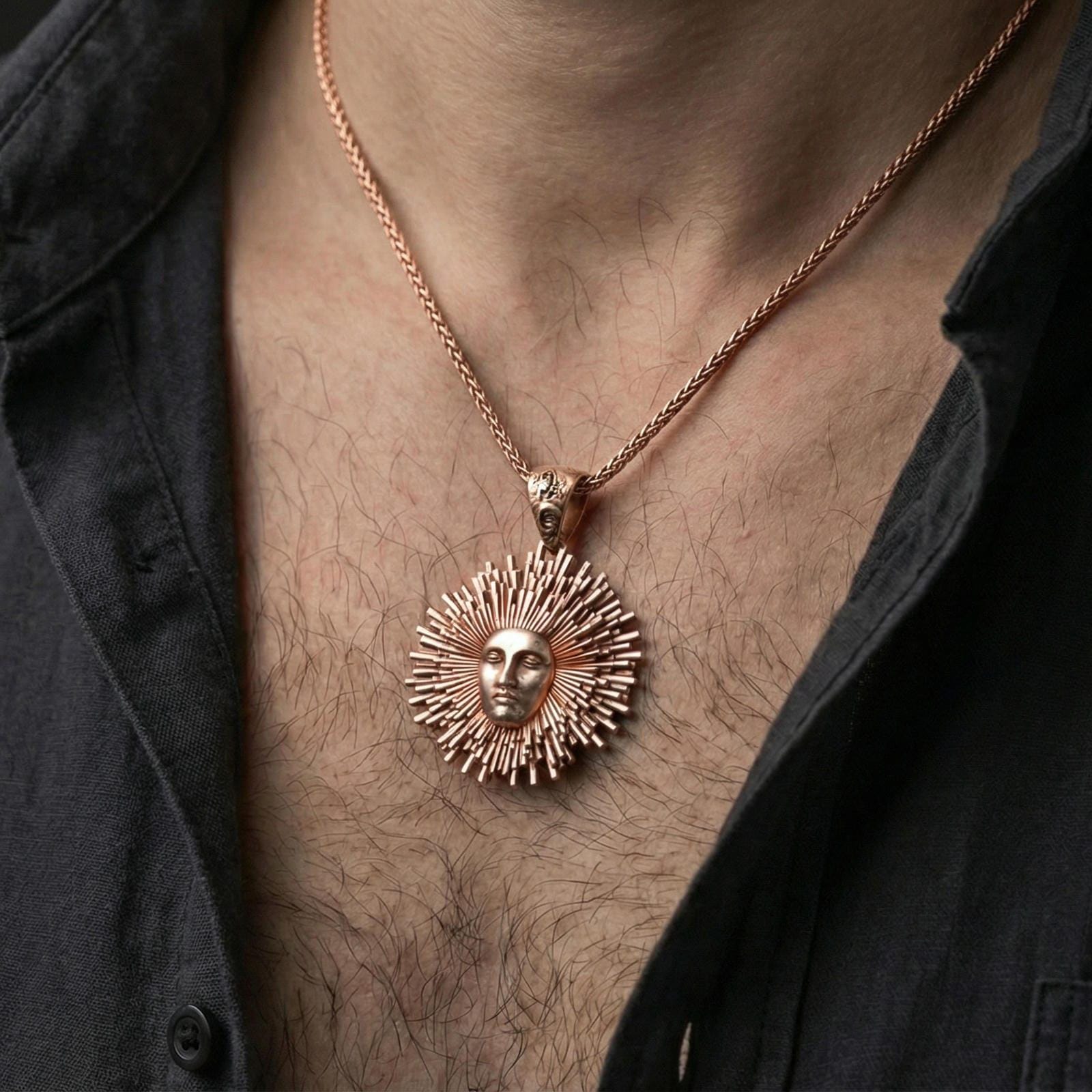 Rose gold plated Helios pendant necklace worn on neck, radiant sunburst rays around Helios face