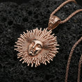 Load image into Gallery viewer, Rose gold plated Helios pendant necklace on dark volcanic stone, sunburst rays around Helios face with bail
