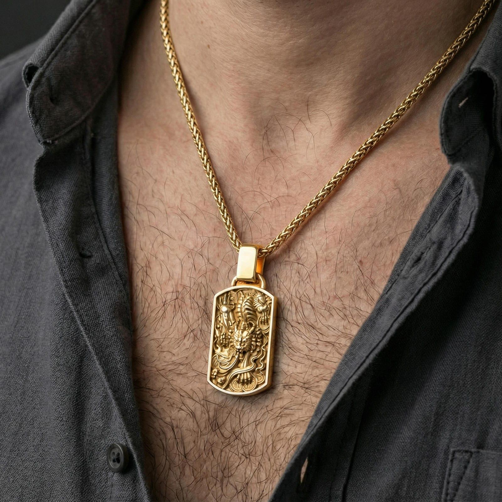 Gold plated foo dog pendant worn on neck, Chinese guardian lion dog tag necklace with detailed relief on braided chain
