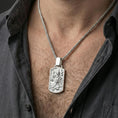Load image into Gallery viewer, Polished silver foo dog dog tag pendant necklace worn on neck, Chinese guardian lion talisman relief design
