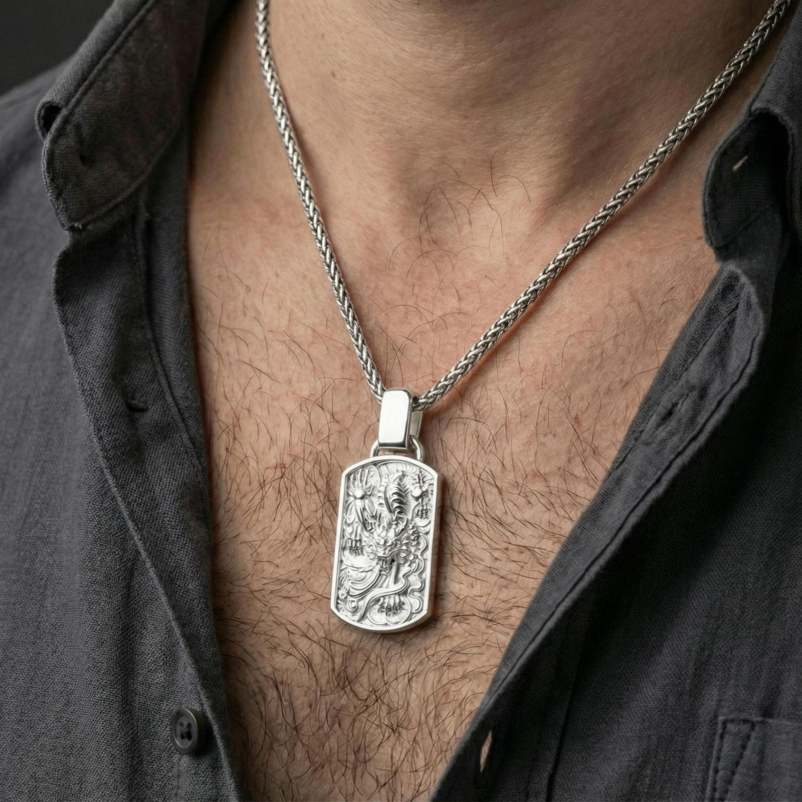 Polished silver foo dog dog tag pendant necklace worn on neck, Chinese guardian lion talisman relief design