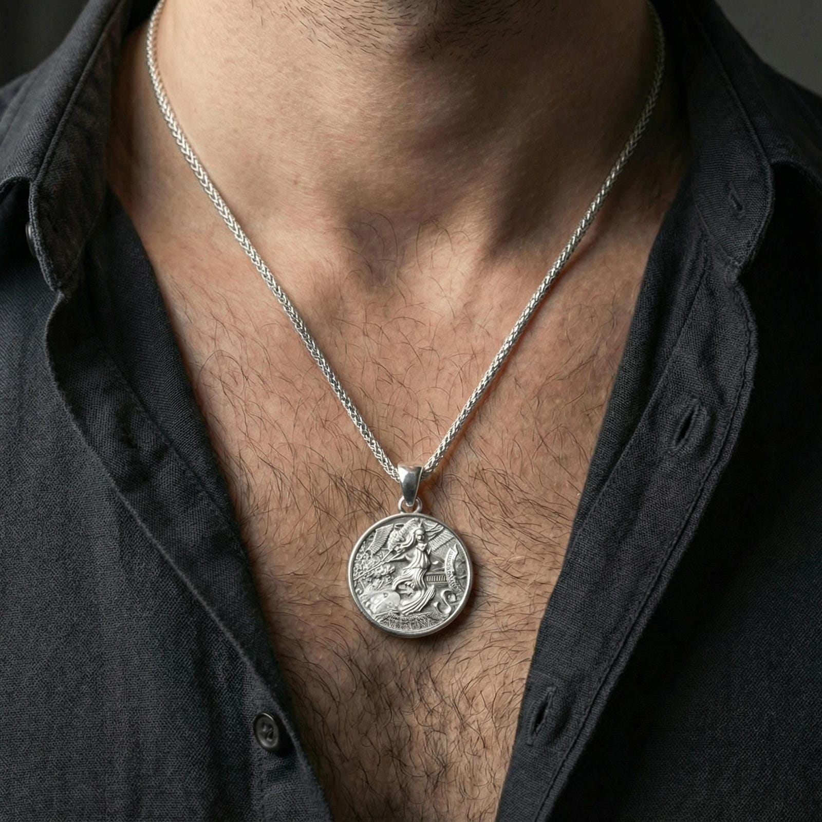 Polished silver Athena coin medallion necklace worn on neck, Greek mythology warrior goddess pendant with shield and serpent