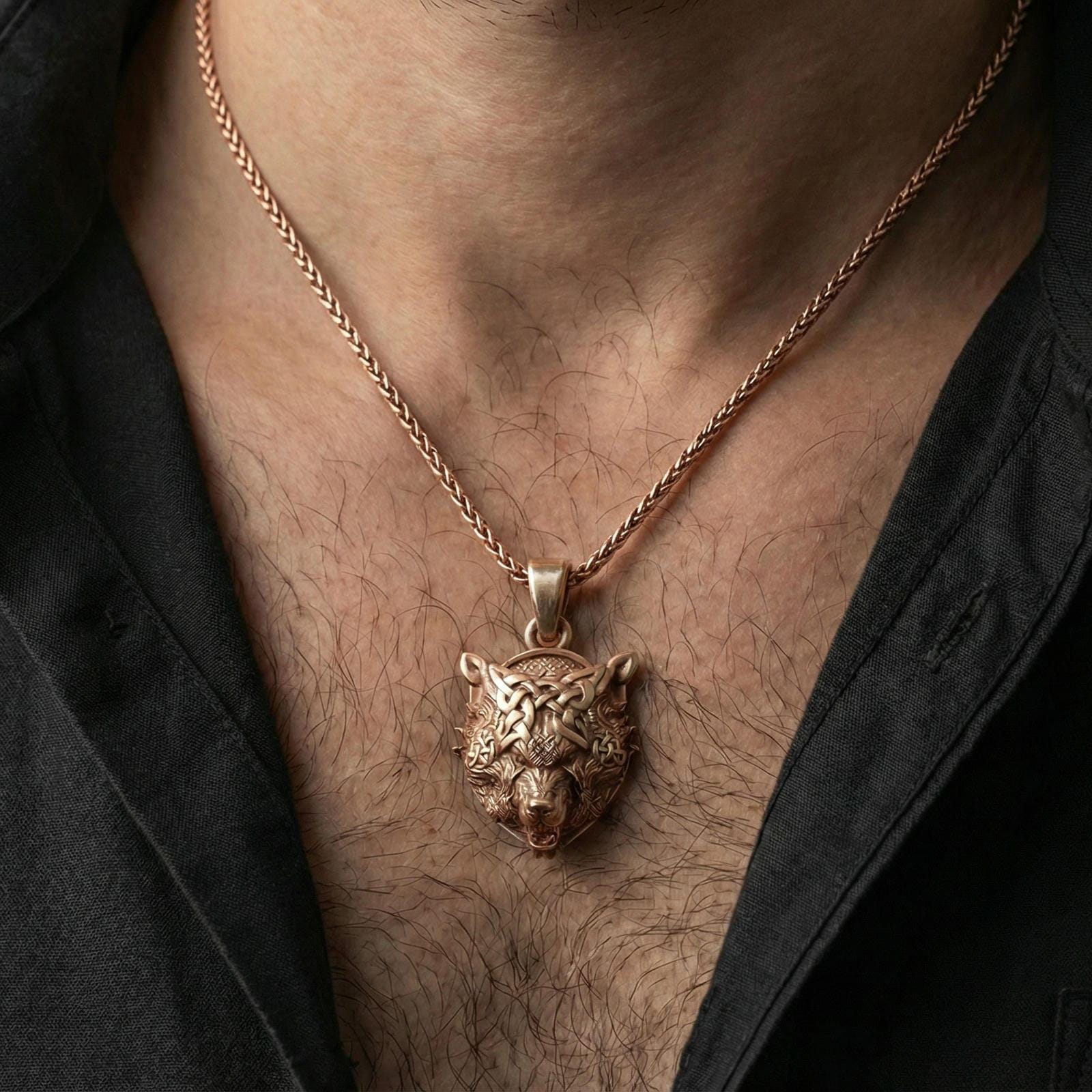 Rose gold plated Fenrir wolf head pendant worn on neck, Viking Fenrir necklace with Nordic symbolism and knotwork
