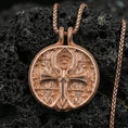 Load image into Gallery viewer, Rose gold plated ankh necklace on dark volcanic stone, Egyptian ankh medallion with Eye symbol centerpiece and intricate patterned backdrop

