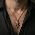 Load image into Gallery viewer, Rose gold plated Medusa skull necklace worn on neck, serpent-wrapped pendant with dramatic gothic detailing and luxury look

