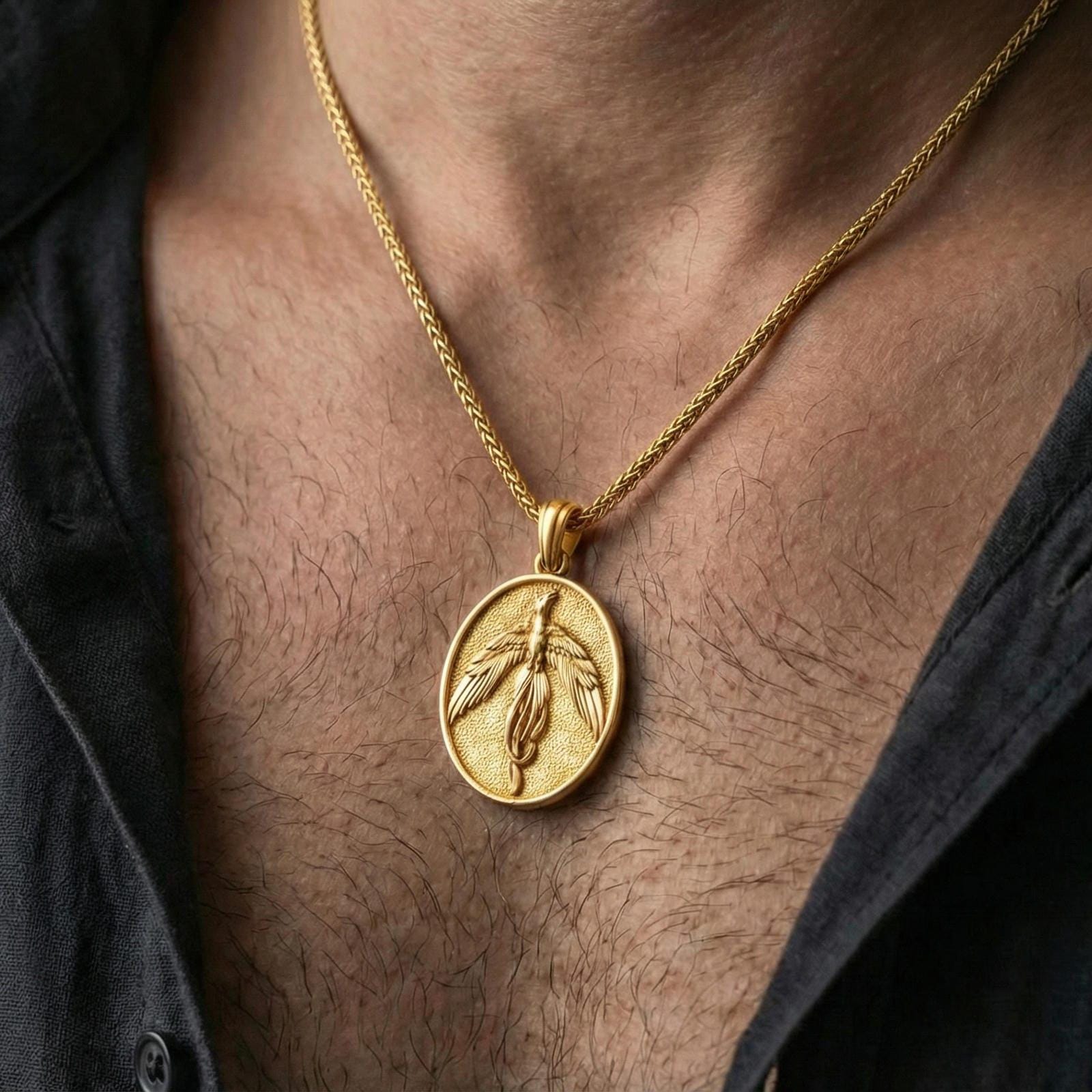 Gold plated phoenix pendant worn on neck, firebird medallion necklace with myth-inspired statement style