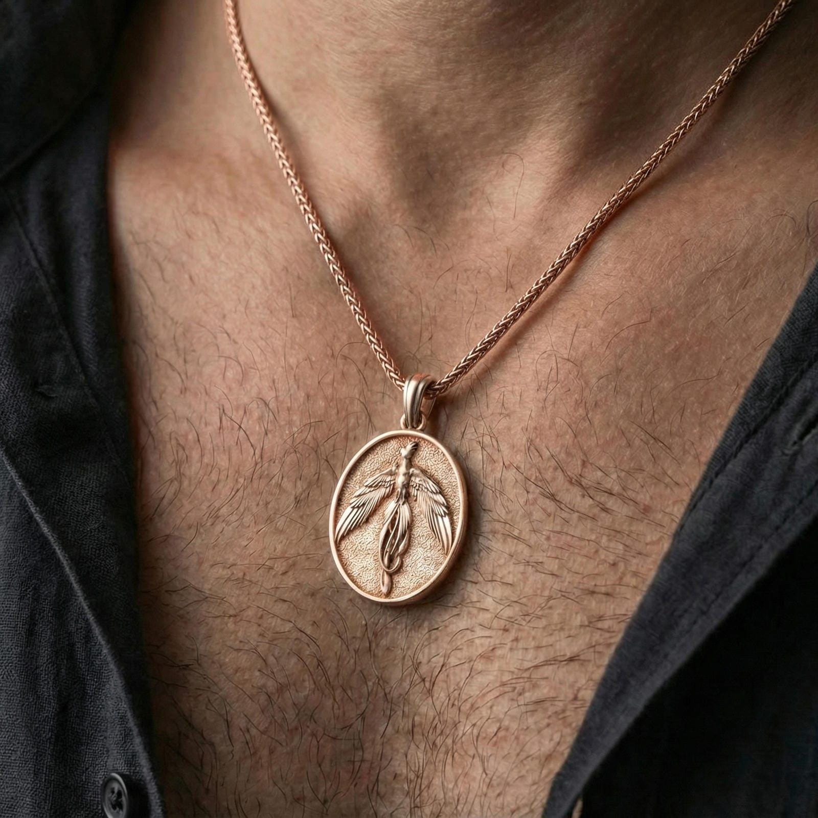 Rose gold plated phoenix medallion necklace worn on neck, elegant rising bird pendant with luxury finish