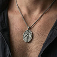 Load image into Gallery viewer, Oxidized 925 sterling silver phoenix pendant worn on neck, rising bird medallion necklace with bold feather detail
