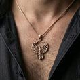 Load image into Gallery viewer, Rose gold plated phoenix necklace worn on neck, elegant phoenix pendant with warm tone and premium detailing

