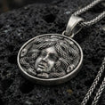 Load image into Gallery viewer, Oxidized 925 sterling silver medusa coin pendant on volcanic rock, greek mythology necklace with snake hair relief

