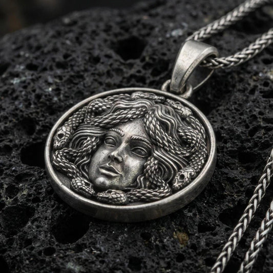 Oxidized 925 sterling silver medusa coin pendant on volcanic rock, greek mythology necklace with snake hair relief