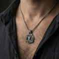 Load image into Gallery viewer, Oxidized 925 sterling silver yggdrasil pendant worn on neck, viking tree of life necklace with knotwork medallion
