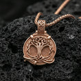 Load image into Gallery viewer, Rose gold plated yggdrasil pendant on dark volcanic stone, norse tree of life medallion with premium sculpted detail

