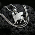 Load image into Gallery viewer, Polished silver lamassu necklace on porous volcanic stone, Mesopotamian protective talisman pendant with fine relief detail

