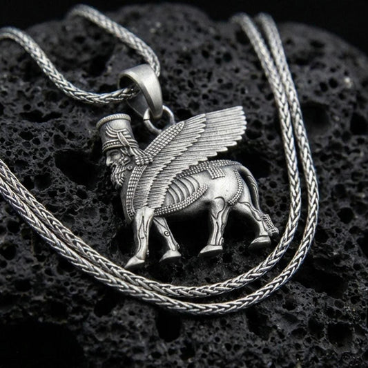 Oxidized 925 sterling silver lamassu pendant on volcanic rock, Assyrian winged bull guardian necklace with braided chain