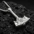 Load image into Gallery viewer, Polished silver Thor hammer necklace on porous volcanic stone, Mjolnir pendant with Celtic knot detail and runic border
