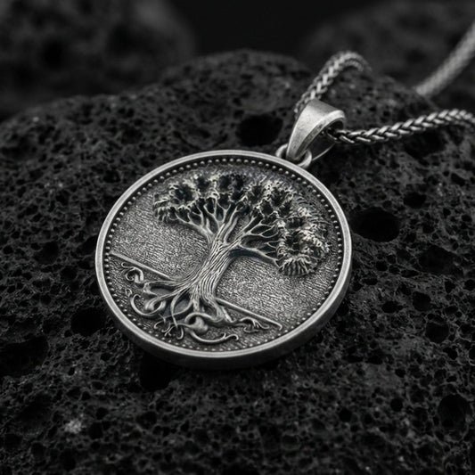 Oxidized 925 sterling silver Tree of Life coin pendant on volcanic rock, Celtic inspired roots and branches necklace