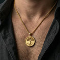 Load image into Gallery viewer, Gold plated Tree of Life coin pendant worn on neck, Yggdrasil inspired necklace for Norse mythology lovers

