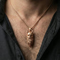 Load image into Gallery viewer, Rose gold plated Mimir head necklace worn on neck, detailed Norse talisman pendant with horned head design
