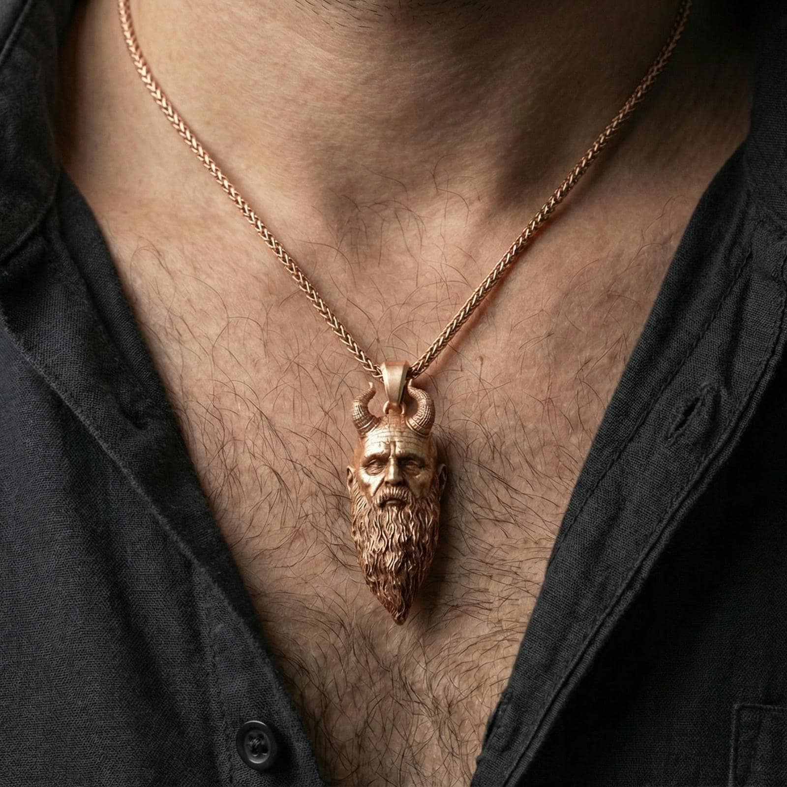 Rose gold plated Mimir head necklace worn on neck, detailed Norse talisman pendant with horned head design