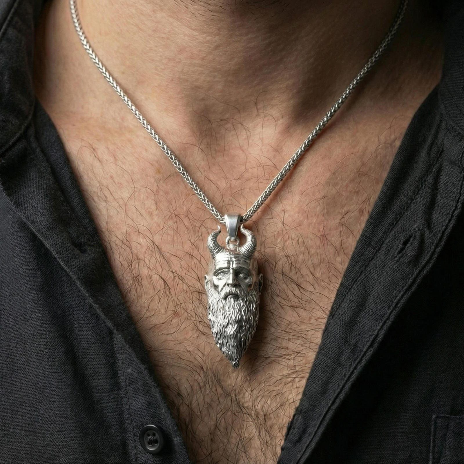 Polished silver Mimir head necklace worn on neck, masculine Norse mythology pendant with realistic facial sculpture