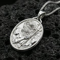 Load image into Gallery viewer, Polished silver Poseidon coin necklace on porous volcanic stone, Greek mythology trident medallion pendant
