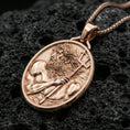 Load image into Gallery viewer, Rose gold plated Poseidon coin necklace on dark volcanic stone, Greek mythology medallion pendant with trident design
