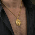 Load image into Gallery viewer, Gold plated Medusa pendant necklace worn on neck, premium styling, myth-inspired medallion as focal point
