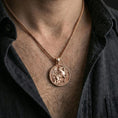 Load image into Gallery viewer, Rose gold plated winged Pegasus pendant necklace worn on neck, lifestyle wear shot, warm plating tone and sculpted depth
