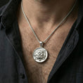 Load image into Gallery viewer, Polished silver guardian lion medallion necklace worn on neck, clean lifestyle framing, reflective finish and sharp details
