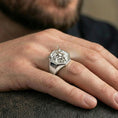Load image into Gallery viewer, Polished silver bull head signet ring worn on finger, clean lifestyle framing, reflective shine and sharp relief definition
