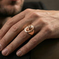 Load image into Gallery viewer, Rose gold plated gorilla head signet ring worn on finger, lifestyle wear shot, warm plating tone and sculpted depth
