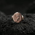 Load image into Gallery viewer, Rose gold plated tiger signet ring on volcanic rock, textured lava stone background, detailed prowling pose engraving
