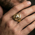 Load image into Gallery viewer, Gold plated bear head signet ring worn on finger, premium styling, statement animal ring as focal point on hand
