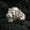 Load image into Gallery viewer, Polished silver angry lion king ring on volcanic rock, high-relief roaring lion face and flowing mane detail, sharp focus shot
