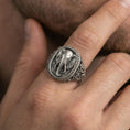 Load image into Gallery viewer, Oxidized elephant signet ring worn on finger, lifestyle close-up, bold animal totem ring with engraved scroll band
