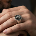 Load image into Gallery viewer, Oxidized lioness signet ring worn on finger, lifestyle close-up, octagon face ring showcasing lioness totem relief
