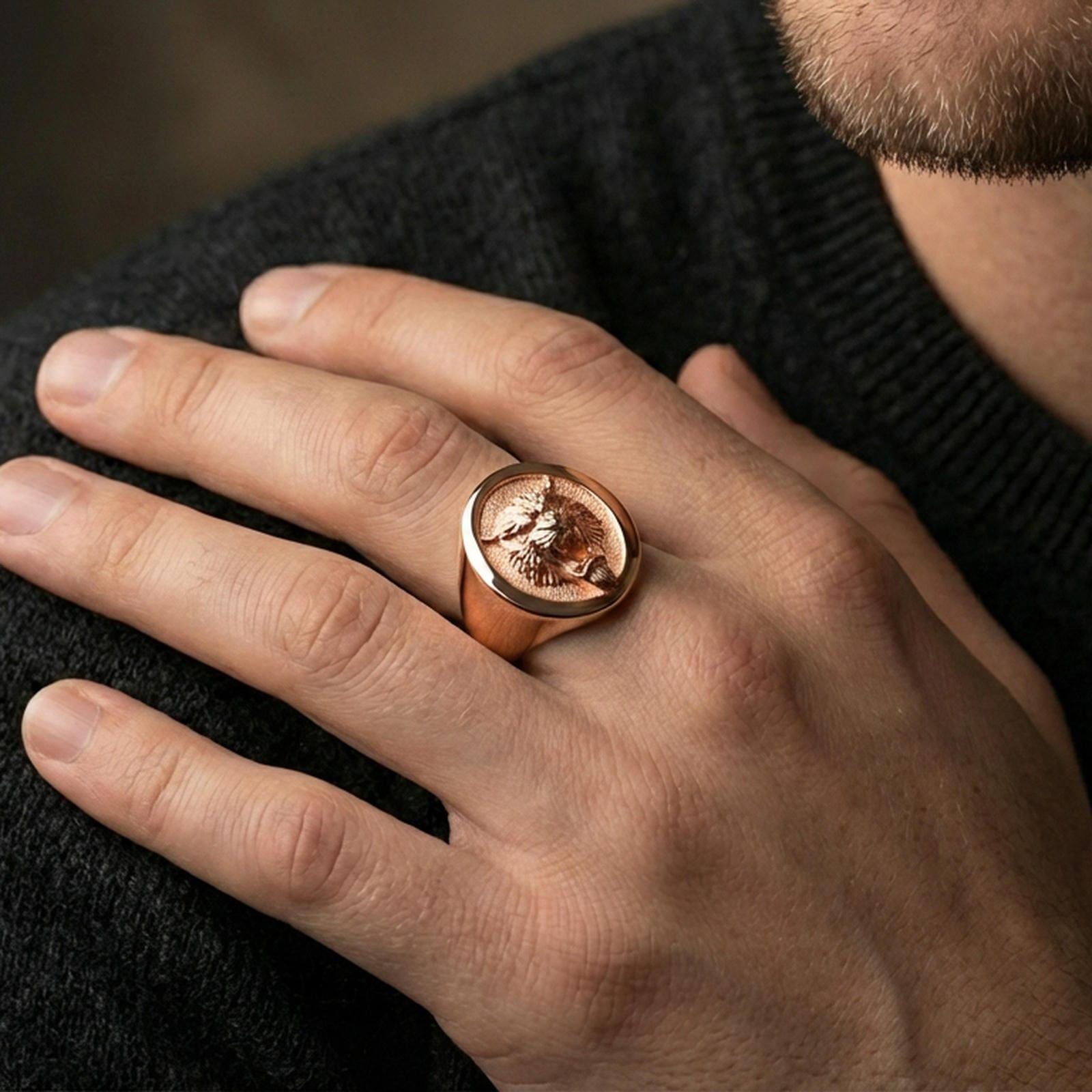 Rose gold plated tiger signet ring worn on finger, lifestyle wear shot, oval tiger head signet highlighting raised relief and smooth bezel
