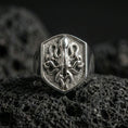 Load image into Gallery viewer, Polished silver octopus signet ring on volcanic rock, shield crest design with high-relief tentacles and crisp border edge, premium close-up shot
