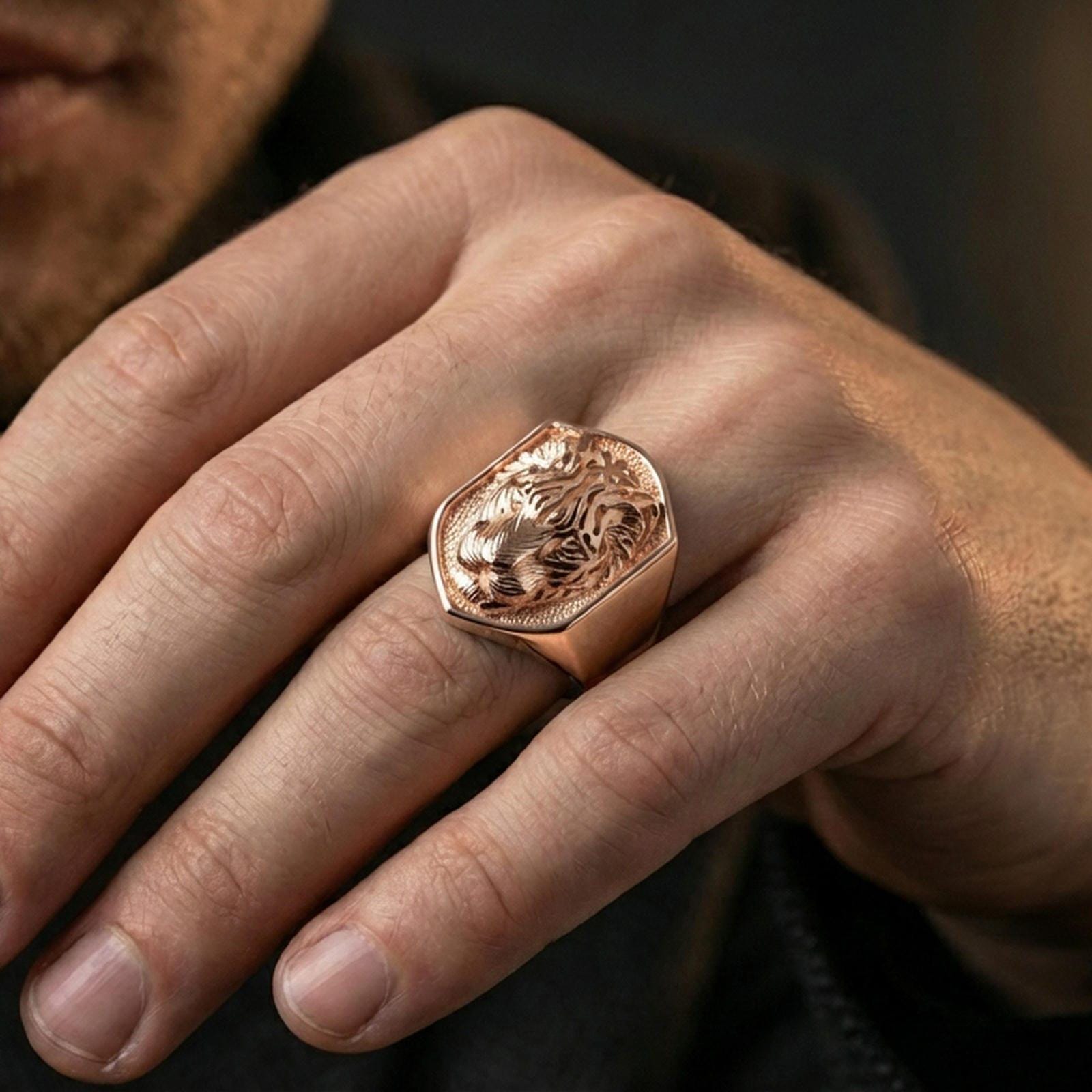 Rose gold plated shield tiger signet ring worn on finger, lifestyle wear shot showcasing shield crest face and detailed tiger relief for statement styling