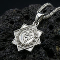 Load image into Gallery viewer, Polished silver Vishuddha chakra necklace pendant on black volcanic stone background, crisp engraved lines, high-end product shot
