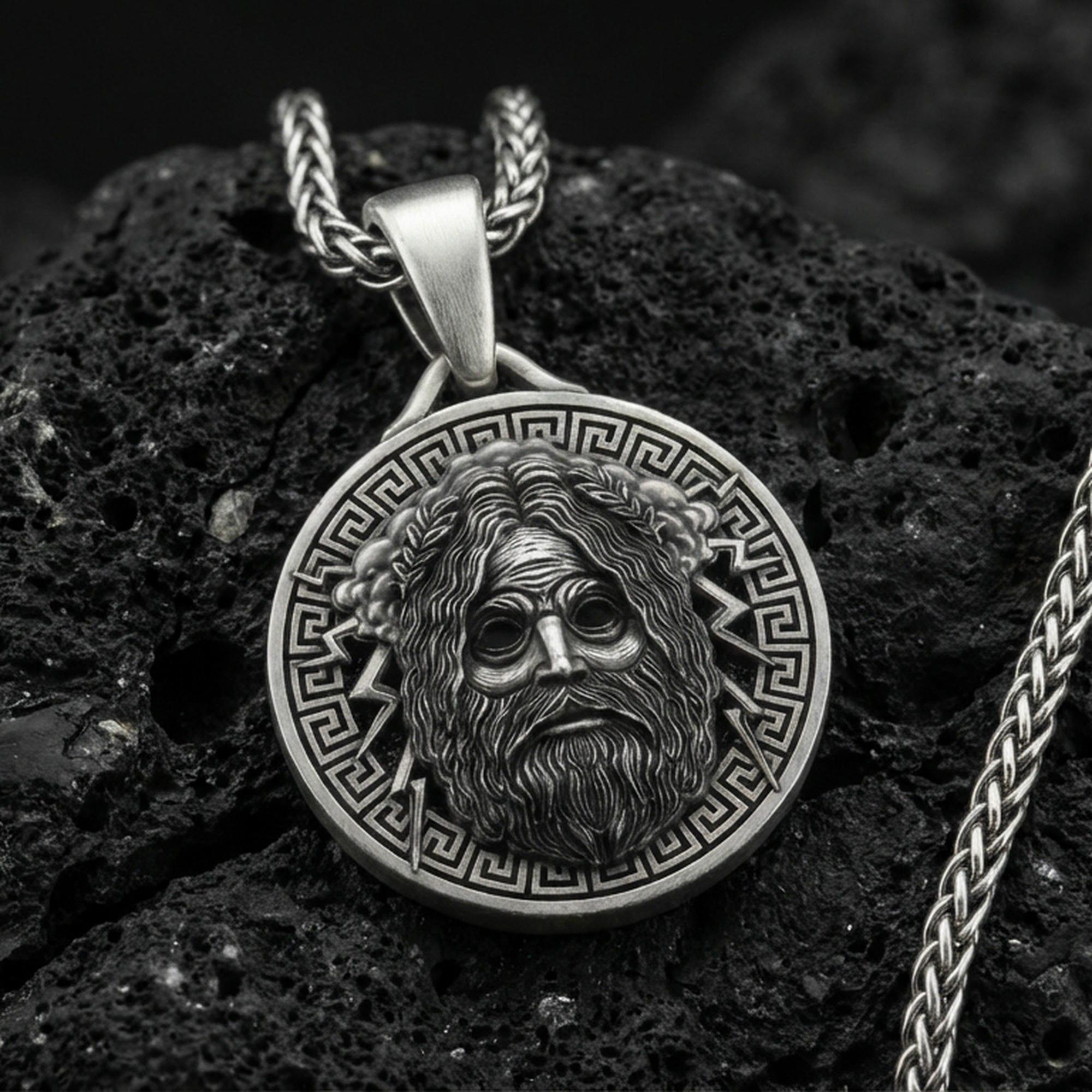 Oxidized Zeus pendant on textured volcanic rock, macro close-up, Greek mythology medallion with lightning detail, premium studio lighting