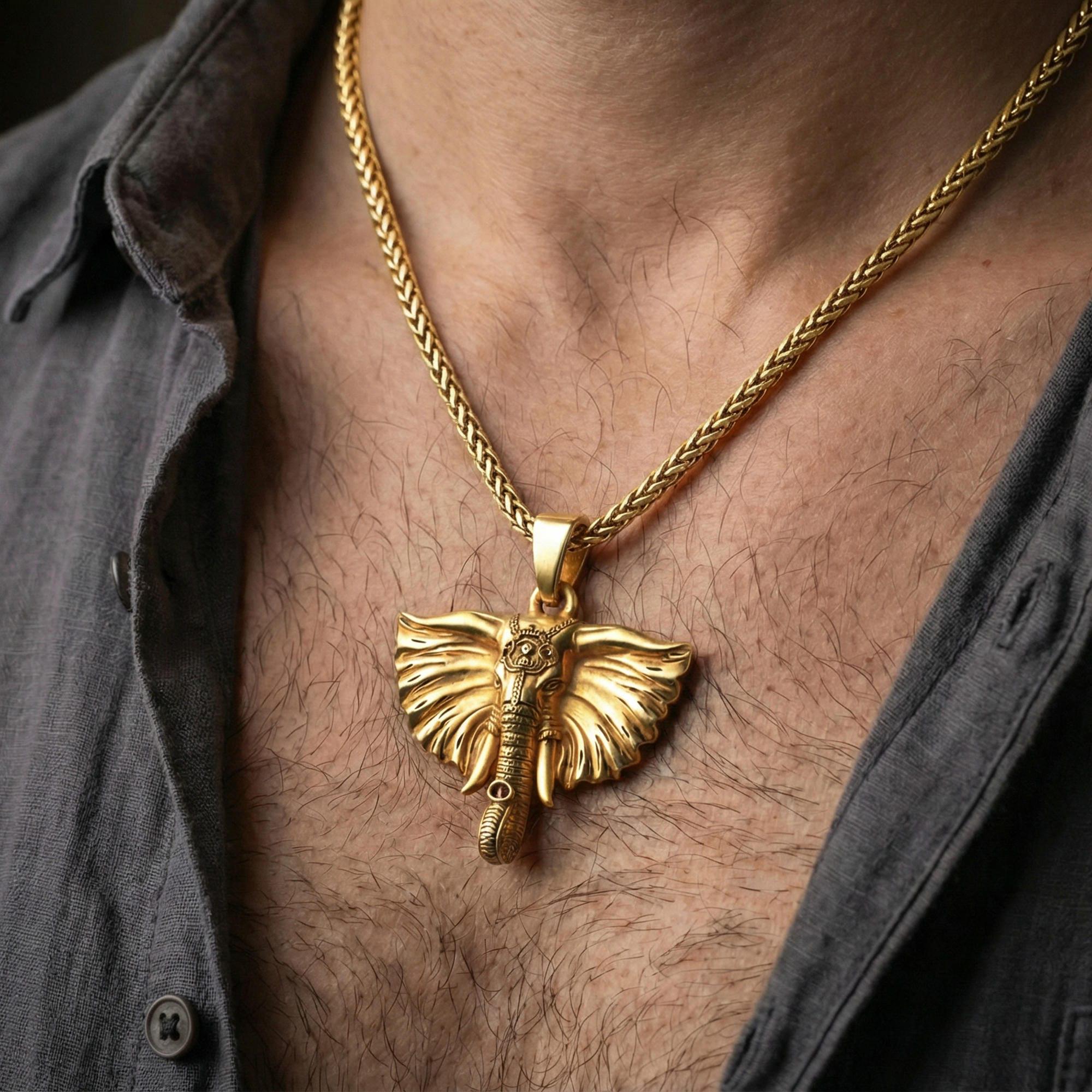 Gold plated elephant necklace pendant worn on neck, close-up lifestyle shot, luxury lighting with refined metallic highlights