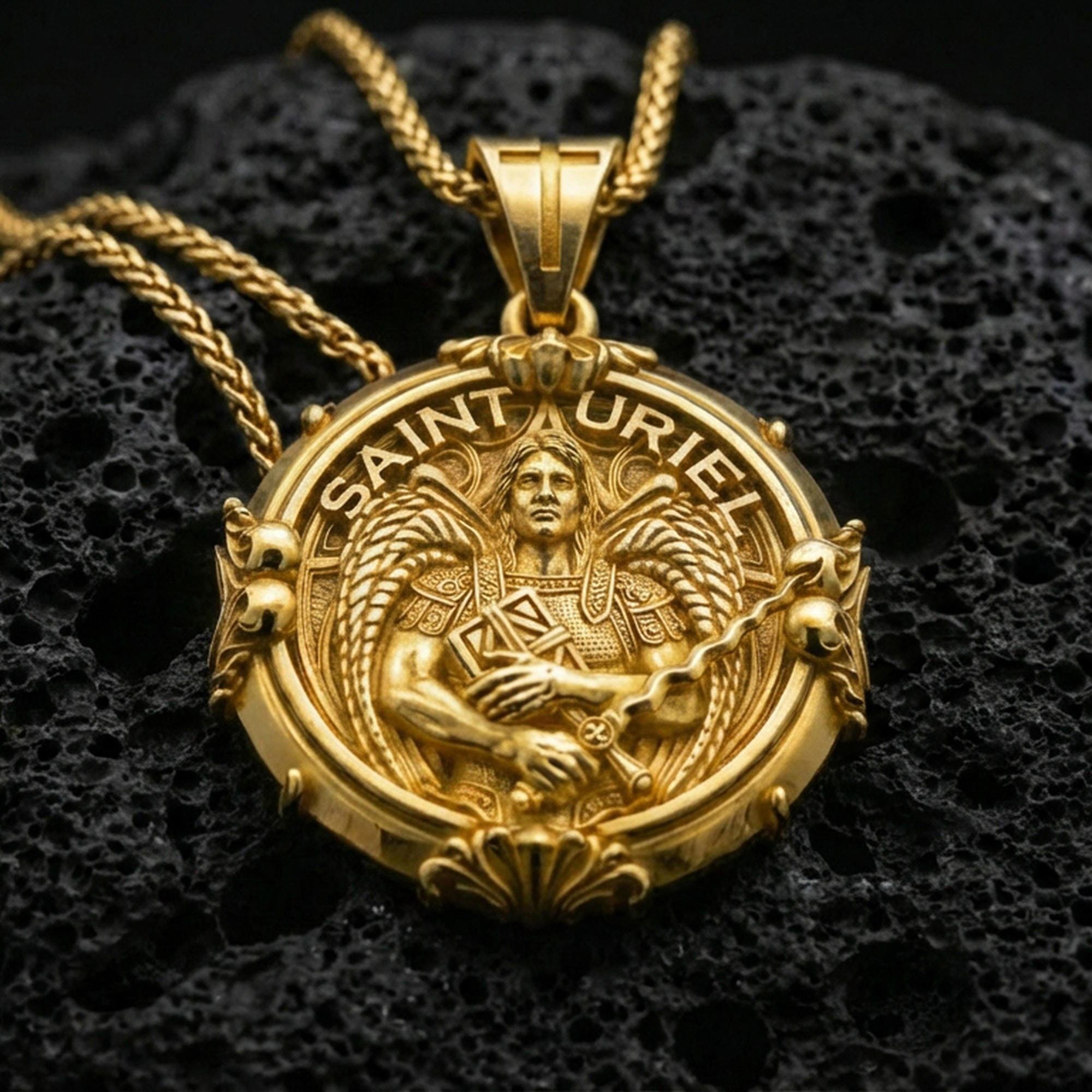 Gold plated Saint Uriel medallion pendant displayed on porous volcanic rock surface, close-up studio composition, detailed lettering and ornate frame