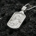 Load image into Gallery viewer, Polished silver Saint Roch dogtag necklace pendant on black volcanic stone background, crisp rectangular frame and patterned backdrop, high-end product shot
